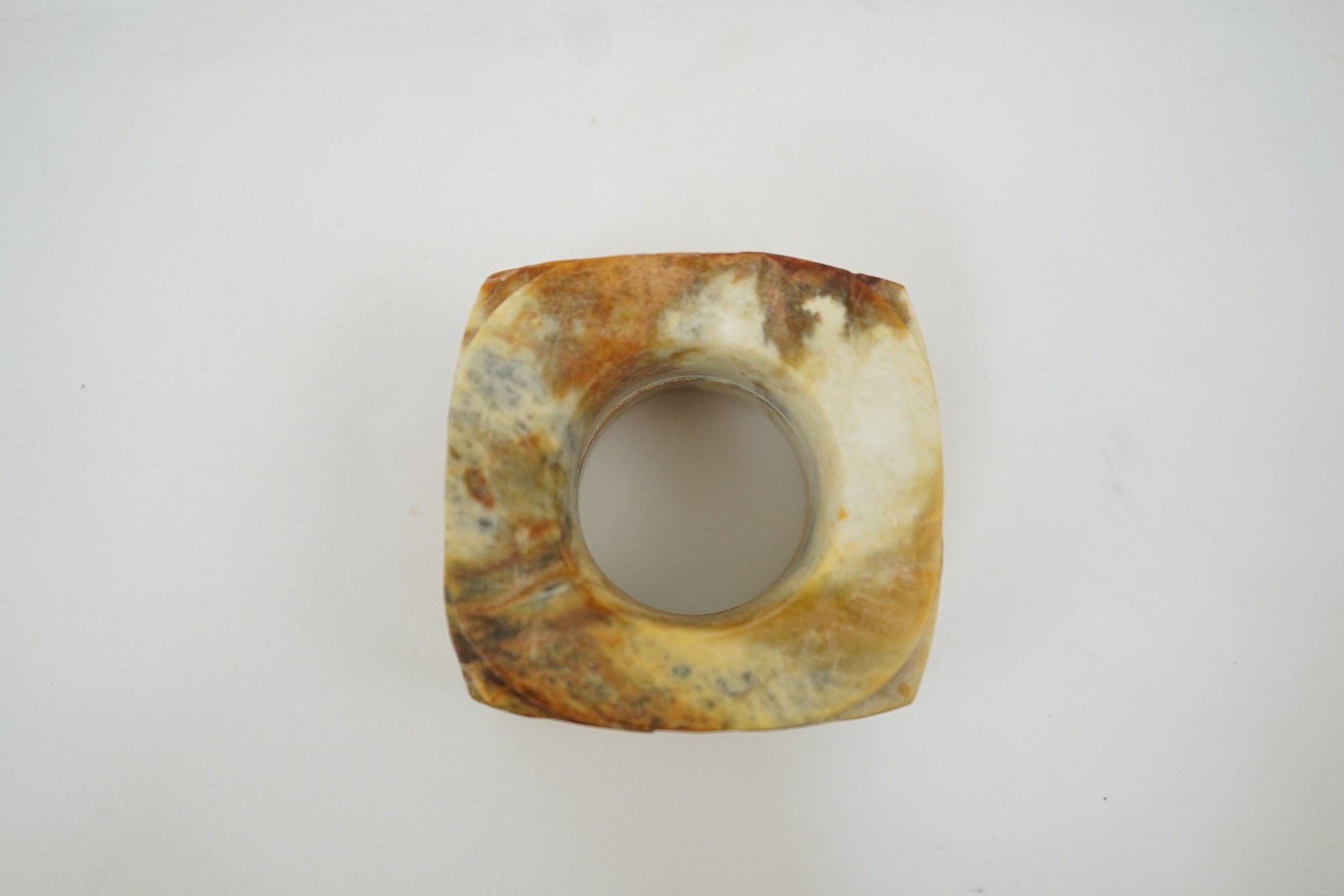Four Chinese archaistic hardstone or burnt jade cong or cylinders